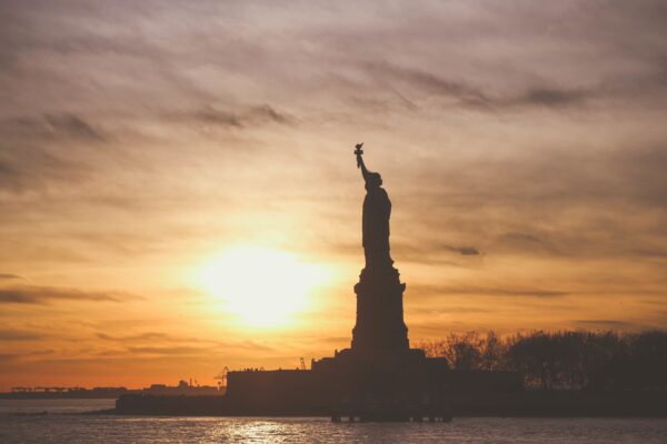 Statue of Liberty at silhouetted in the sunset