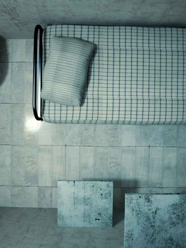 prison cell with bed and sink