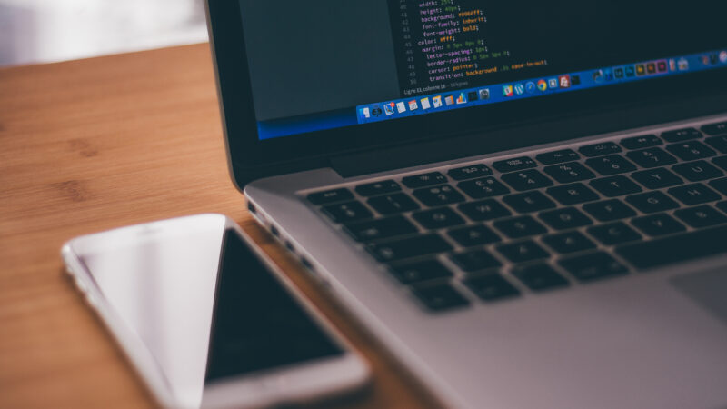 computer and cell phone next to each other