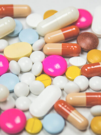 A jumble of pills of various shapes, sizes, and colors