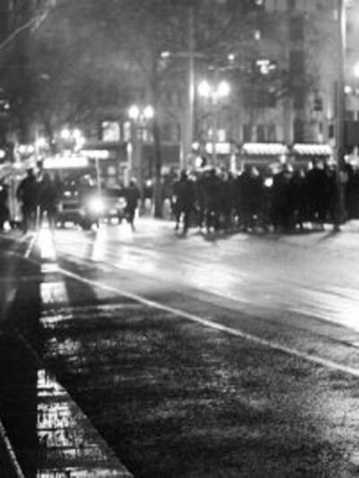 protester faces off with police