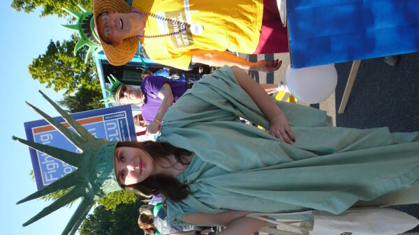 aclu supporter dressed as lady liberty marching