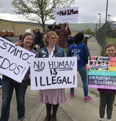 Gorge Ice Resistance protesters holding signs outside of NORCOR