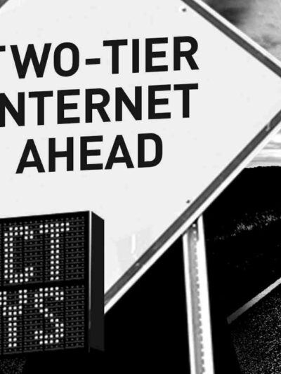 signs that say "expect delays" "two-tier internet ahead" "protect internet freedom"