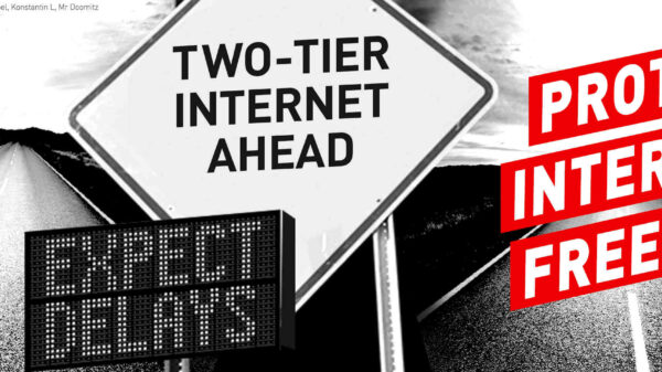 signs that say "expect delays" "two-tier internet ahead" "protect internet freedom"