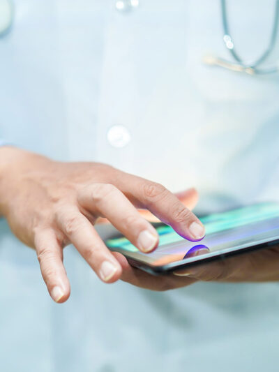 A doctor using a tablet