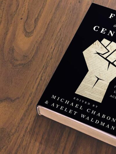 A black book titled "Fight of the Century" edited by Ayelet Waldman and Michael Chabon, lies on a wooden table