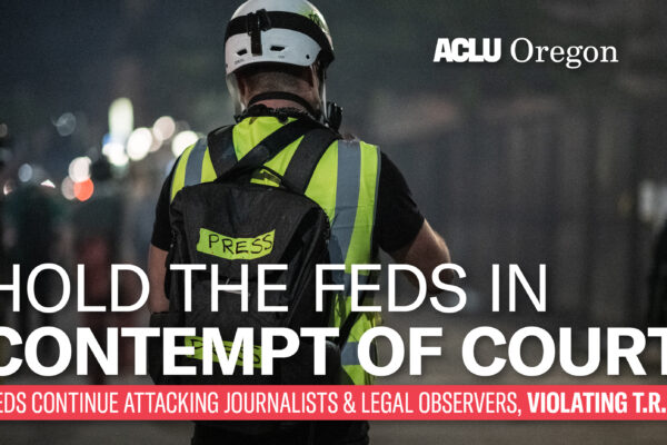 person marked as press with banner