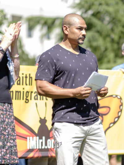Isidro Andrade-Tafolla speaks to a crowd outside the Washington County Courthouse