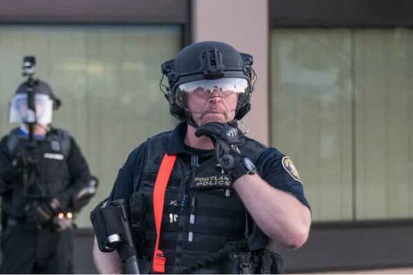 Photo of Portland police officer livestreaming protest