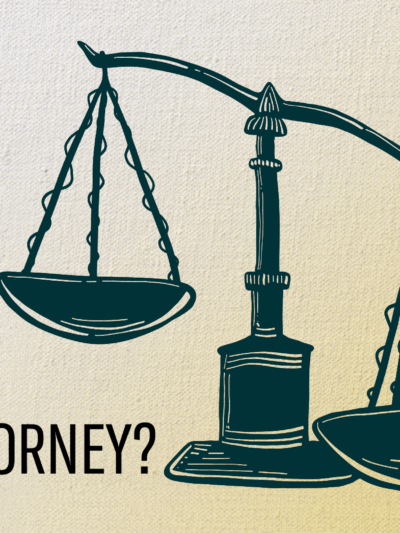 Why vote for your county's next district attorney? Image of a person's hand tipping one side of the scales of law.