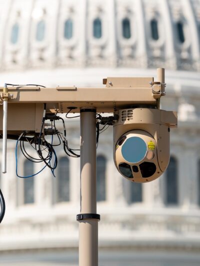 A close-up of a video surveillance unit set up in front of the U.S. Capitol building.