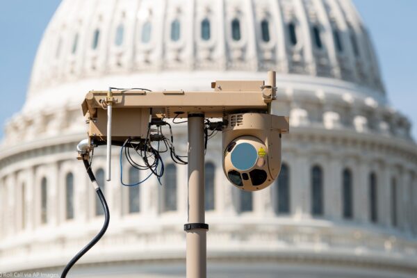 A close-up of a video surveillance unit set up in front of the U.S. Capitol building.