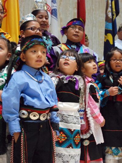 Children from the Zuni Pueblo lead the U.S. pledge of allegiance in the Zuni language in the New Mexico state Capitol in Santa Fe, N.M.
