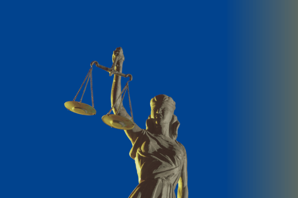 Blue background with an image of the lady of justice statue in the center.