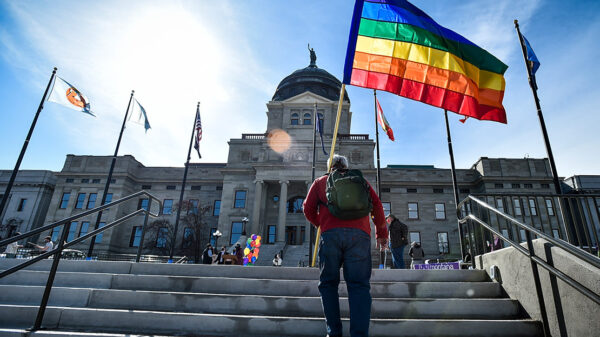 Demonstrators gather on the steps of the Montana State Capitol protesting anti-LGBTQ+ legislation.