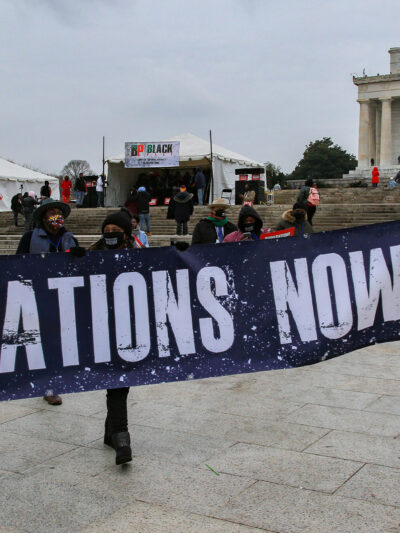 Demonstrators with the Reparationist Collective gather at the Lincoln Memorial in Washington, D.C. to demand reparations from slavery and inequity