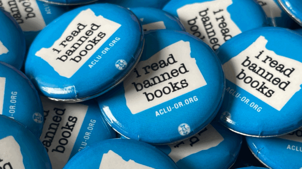 A pile of blue "I read banned books" pins