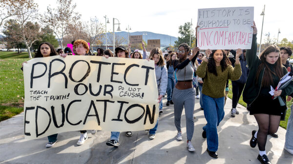 High school students march in protest of the district's ban of critical race theory curriculum at Patricia H. Birdsall Sports Park in Temecula, Calif., on Friday, Dec. 16, 2022.