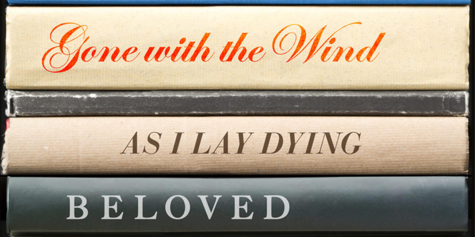 A stack of old banned books with the titles on the spine