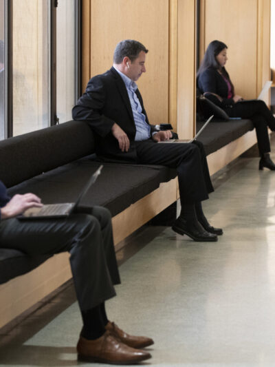 Legislators sitting down and waiting