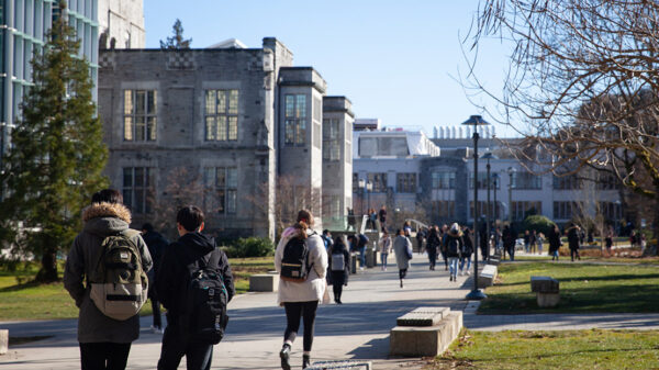 Students walking down a campus.