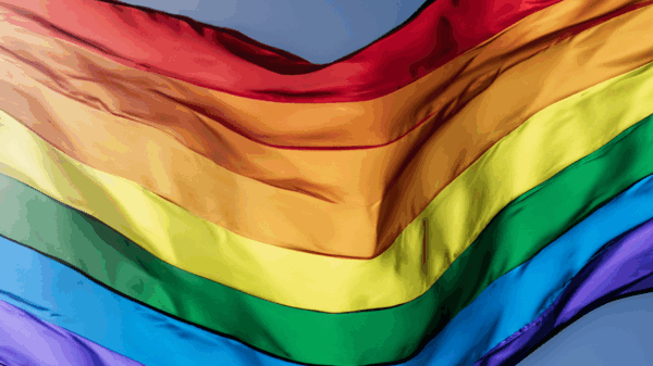 a rippling rainbow flag