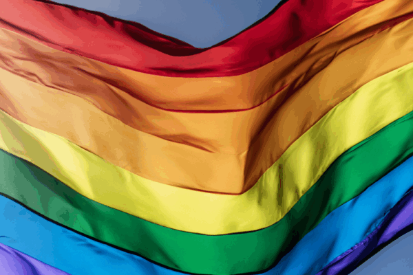 a rippling rainbow flag