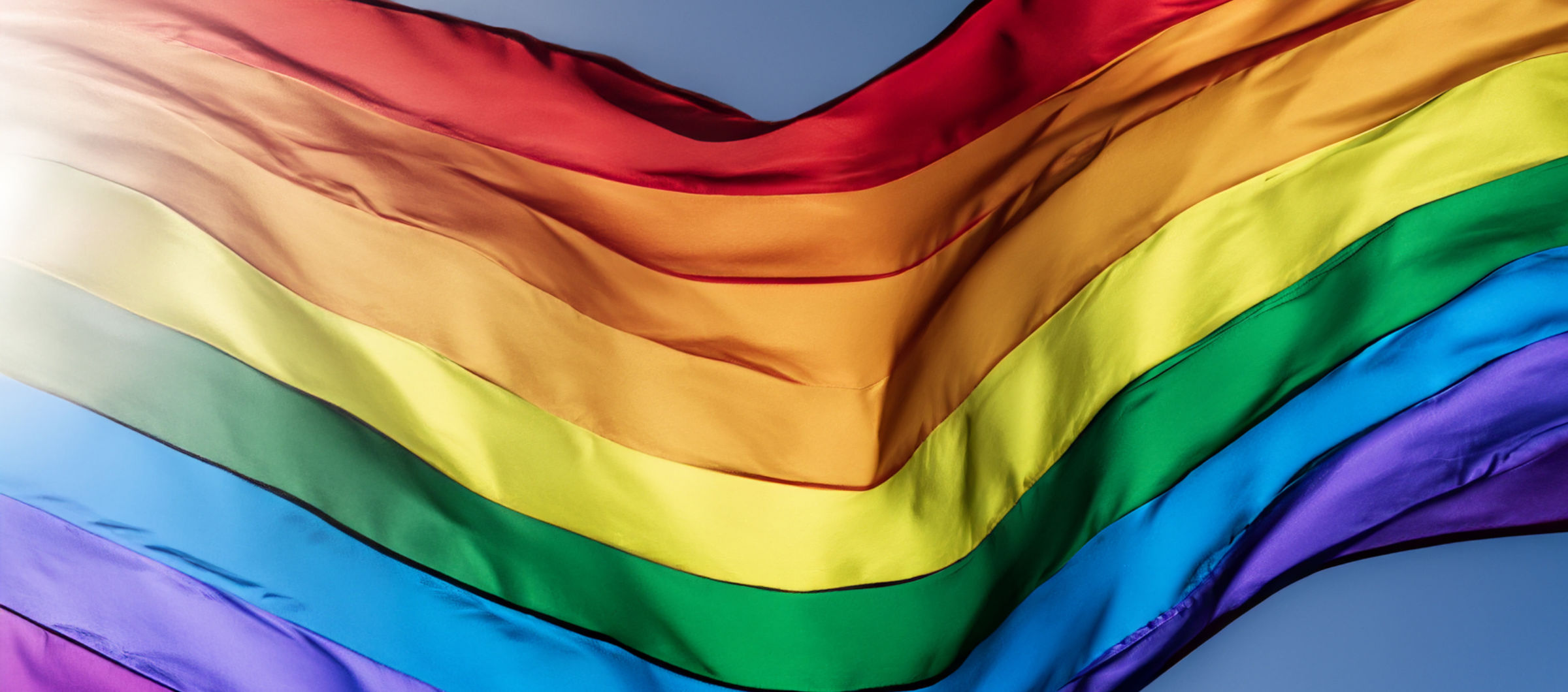 a rippling rainbow flag