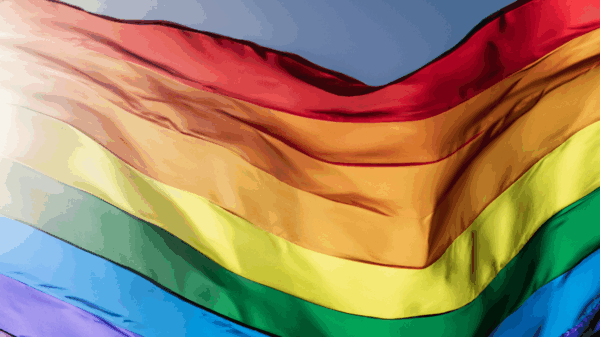 a rippling rainbow flag