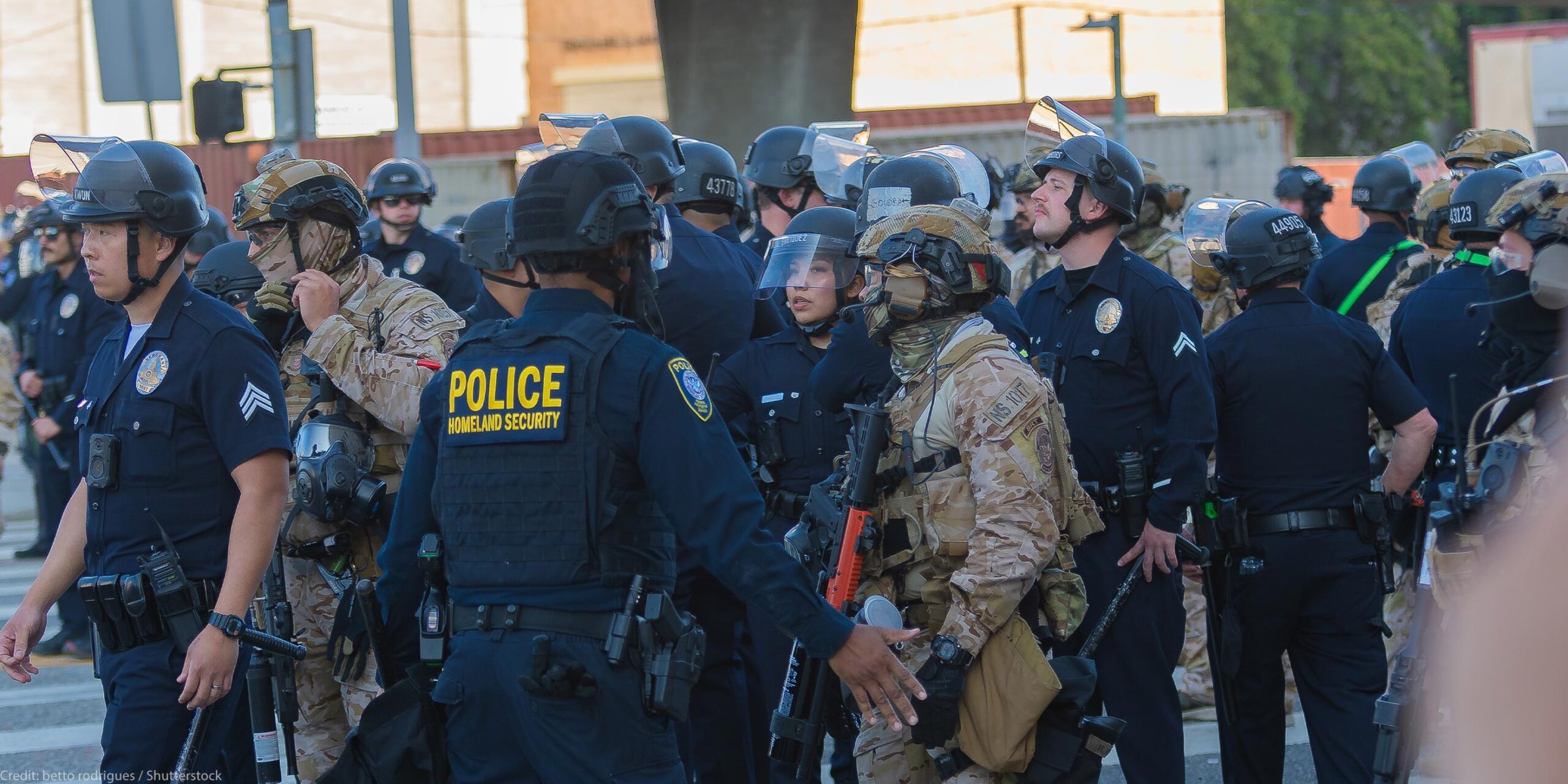 Border Patrol agents and police congregating during during a demonstration against expanded ICE operations and in support of immigrant rights.