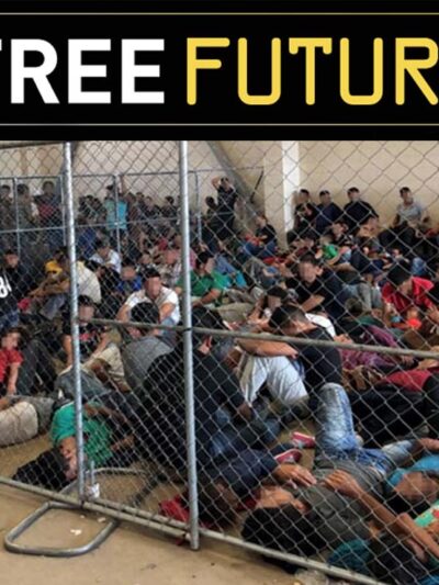 Immigrants behind chain link fence in an overcrowded detention area