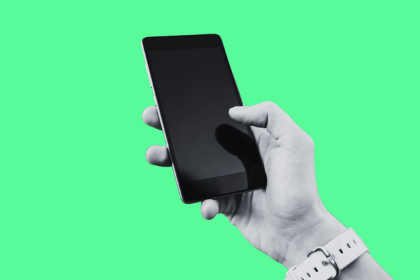Image with green background and an image of a hand holding a phone.