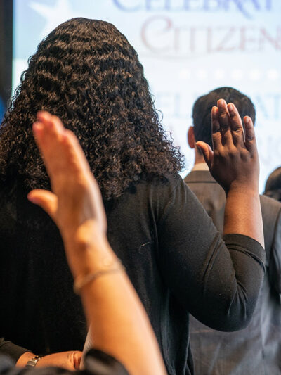 New naturalized US citizens take Oath of Allegiance at special naturalization ceremony.