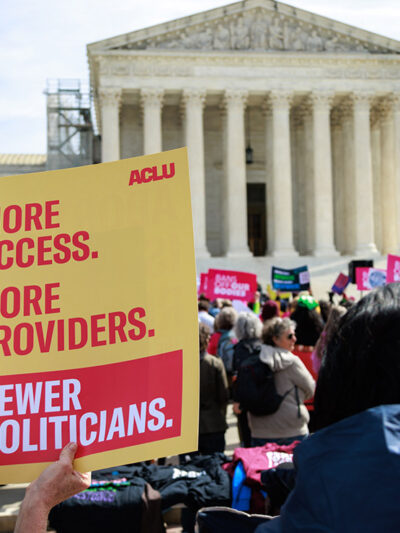 Demonstrators holding posters advocating for reproductive freedom outside of the U.S. Supreme Court in Washington, D.C.