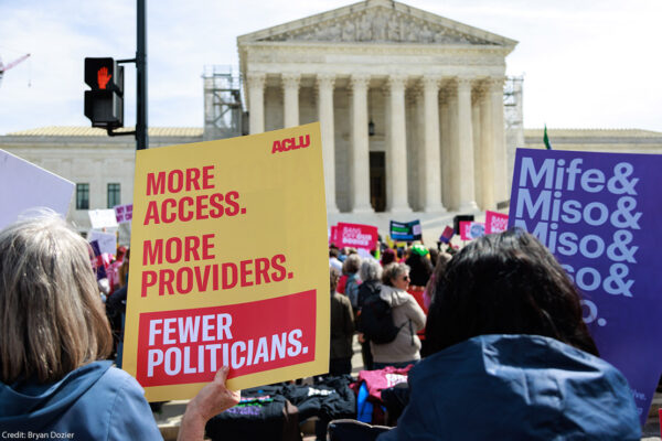Demonstrators holding posters advocating for reproductive freedom outside of the U.S. Supreme Court in Washington, D.C.