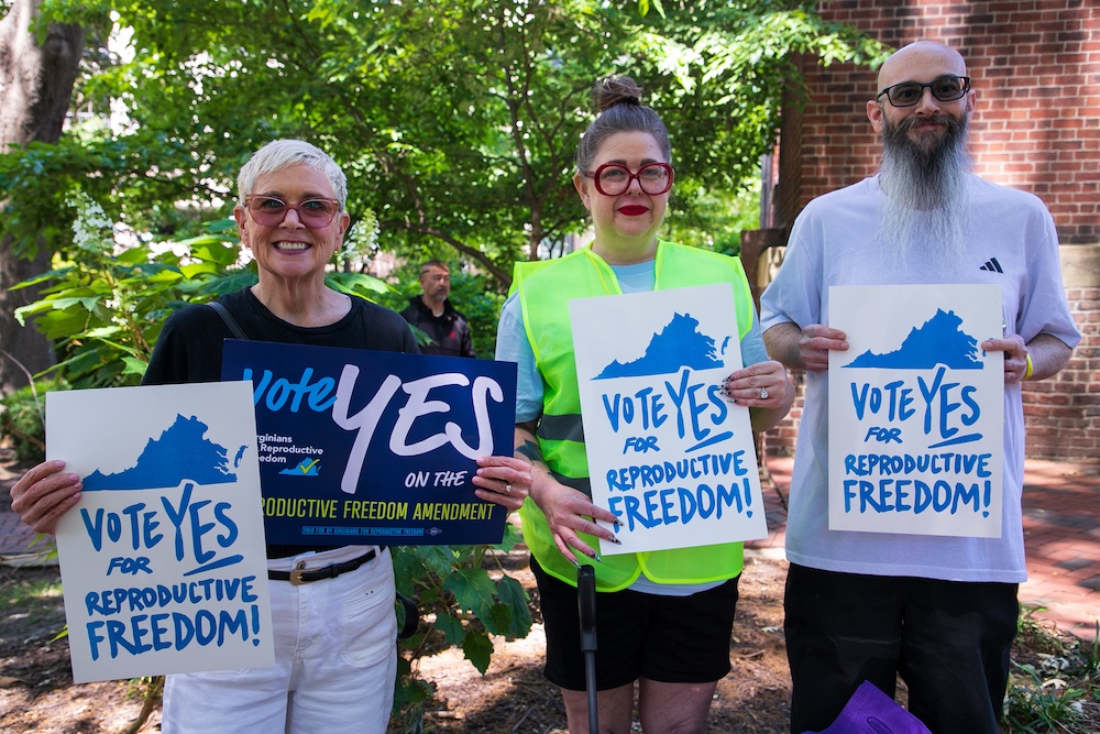 (From left to right) ACLU-VA Executive Director Mary Bauer, Heather St. Amand, and her husband join hundreds of Virginians at the capitol in Richmond for Virginians for Reproductive Freedom's campaign kickoff.