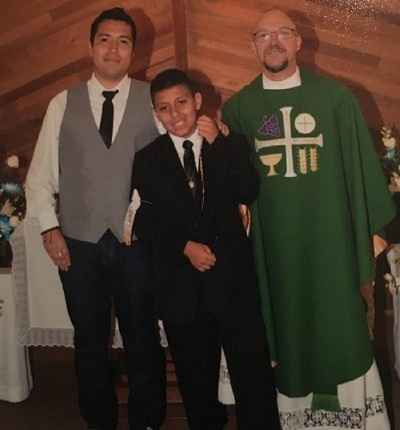 DACA recipient with brother and priest