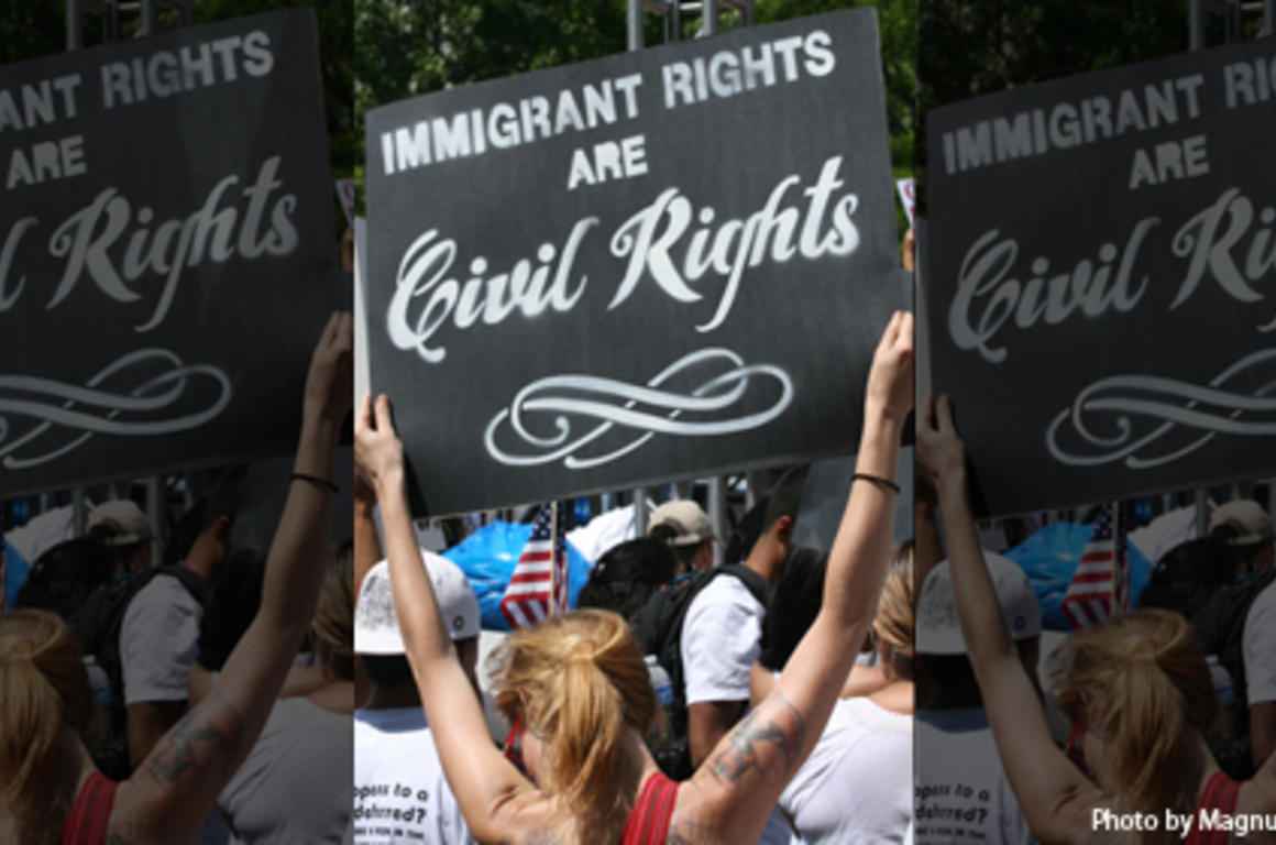 immigrant rights sign at rally
