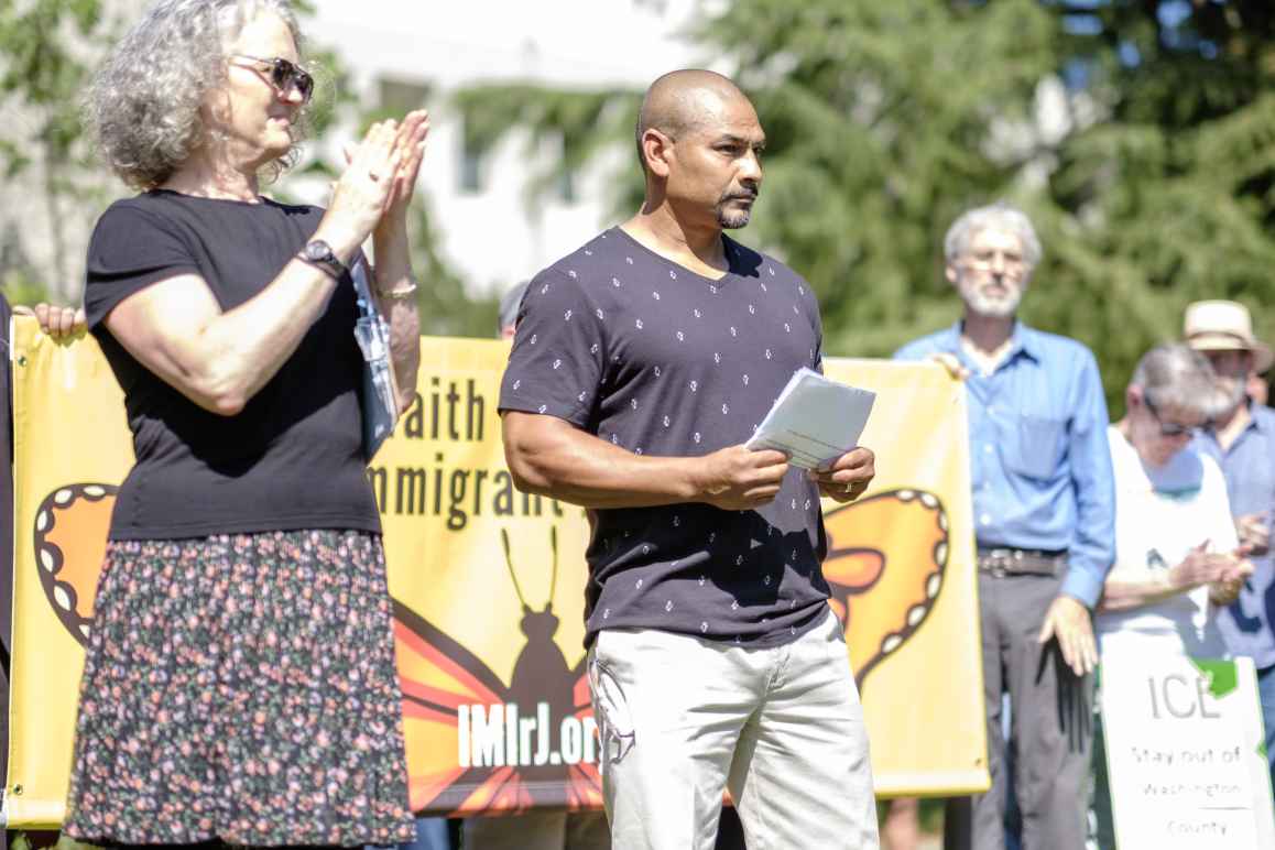 Isidro Andrade-Tafolla speaks to a crowd outside the Washington County Courthouse