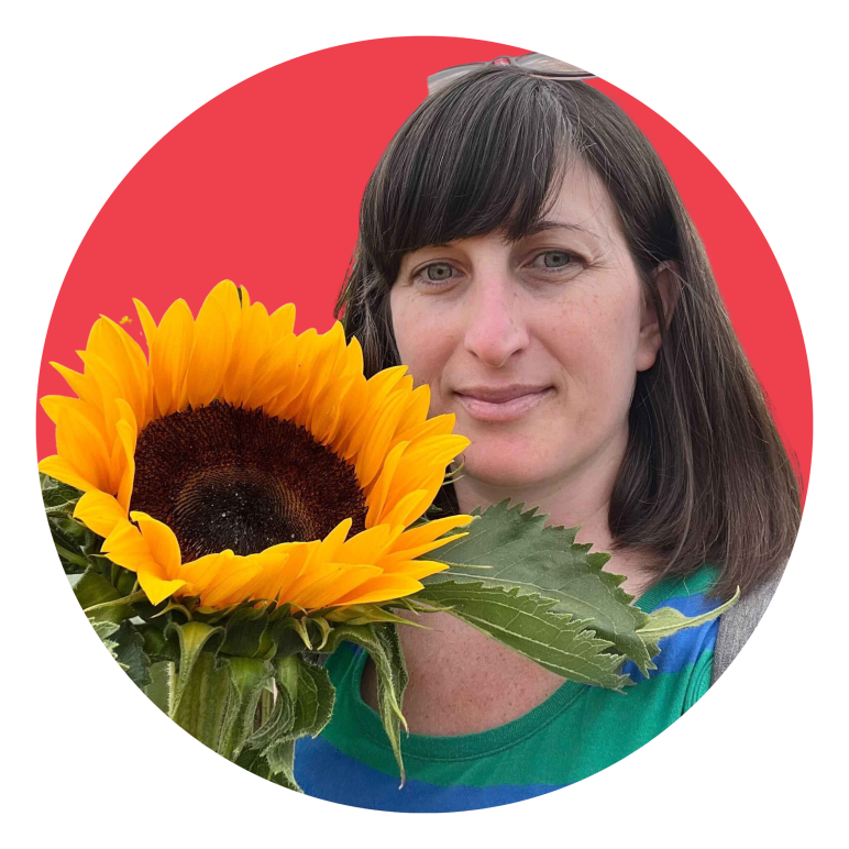 photo of Melissa and sunflower with background of red circle