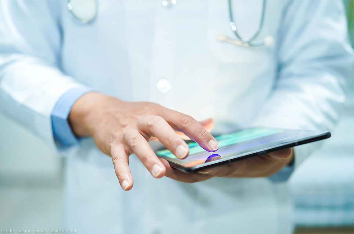 A doctor using a tablet