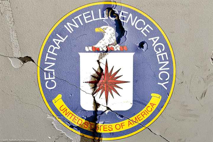 CIA logo on cracked wall.