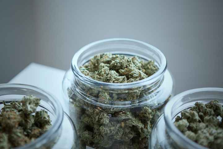 Photo by Get Budding Dried marijuana in jars