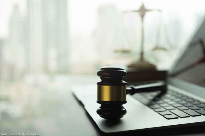 A gavel on a laptop.