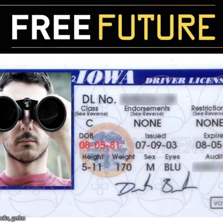 A driver's license in which the photo shows a man peering at the camera through binoculars