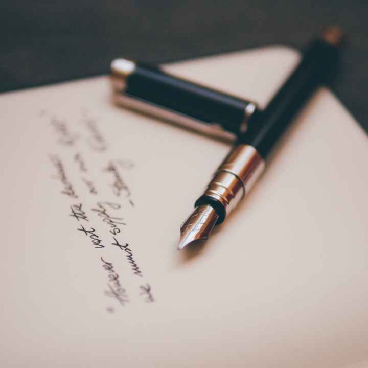 Photo by Alvaro Serrano A fountain pen lies on a handwritten note