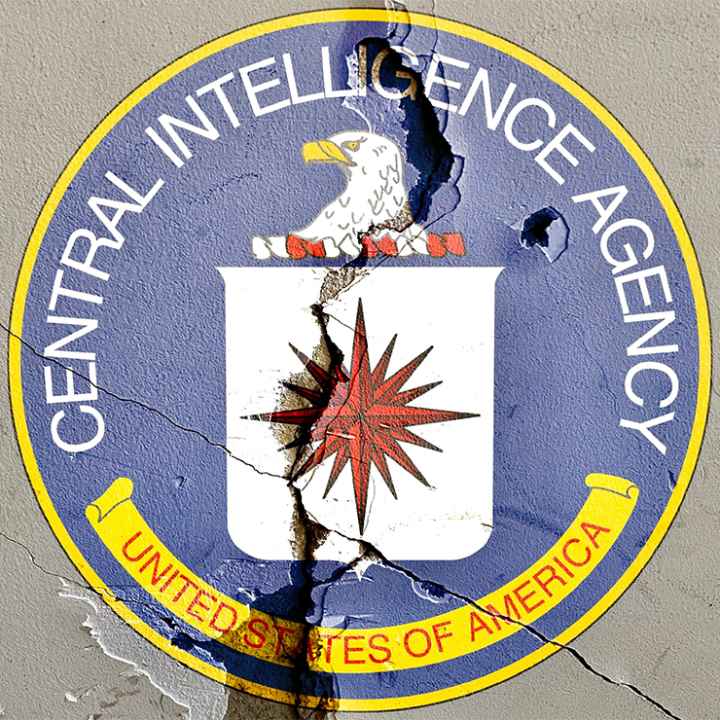 CIA logo on cracked wall.