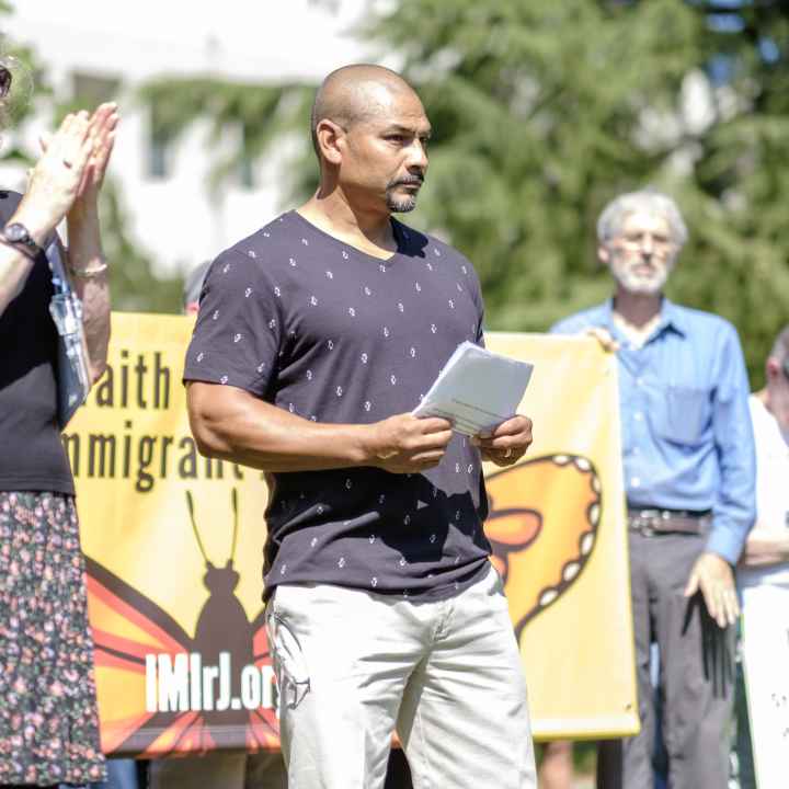 Isidro Andrade-Tafolla speaks to a crowd outside the Washington County Courthouse