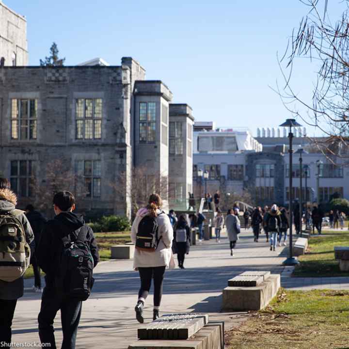 Students walking down a campus.